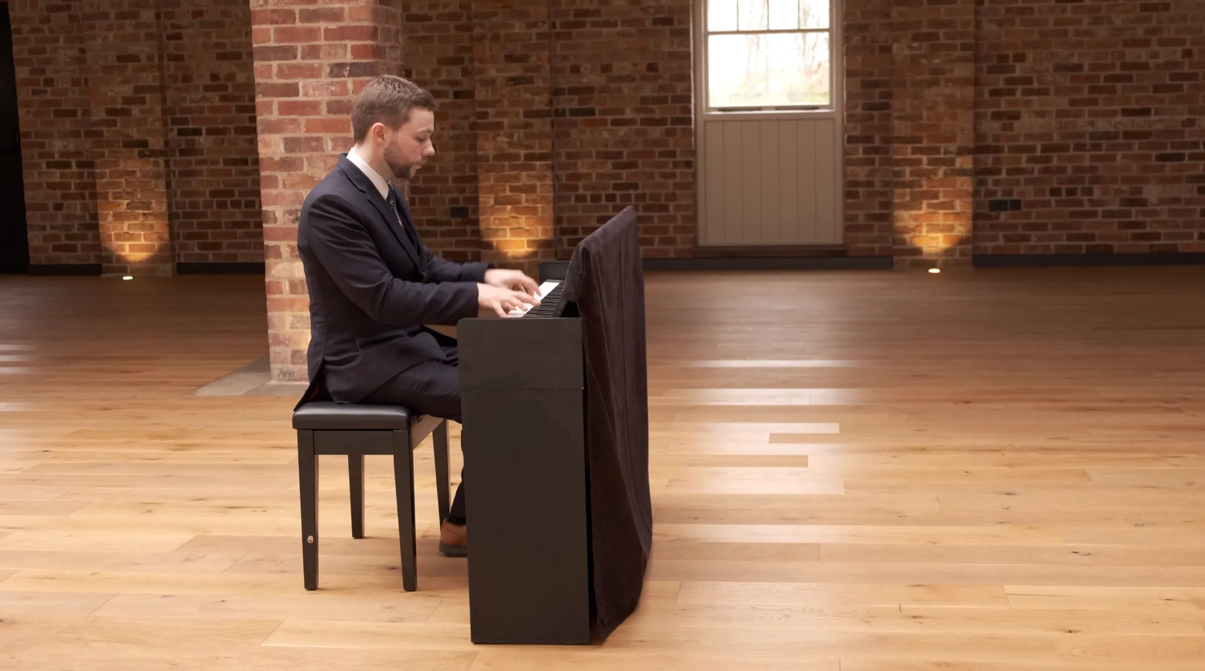 Finn playing in a wide brick hall