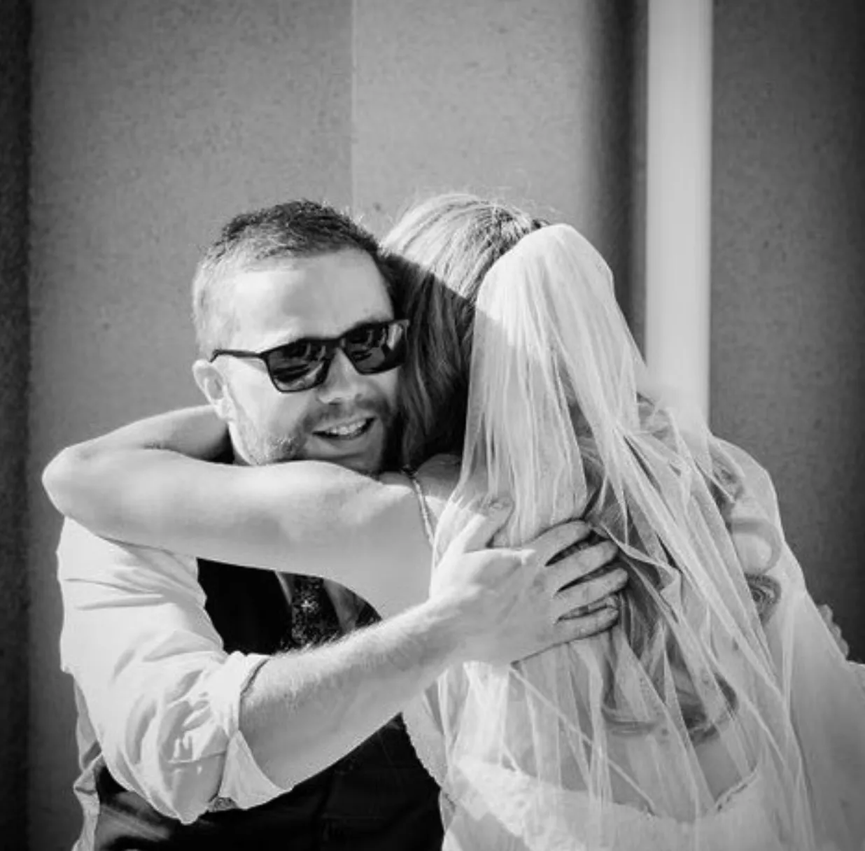 A bride hugging Finn after the ceremony